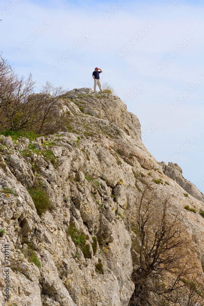 Active people - Person climbing a cliff