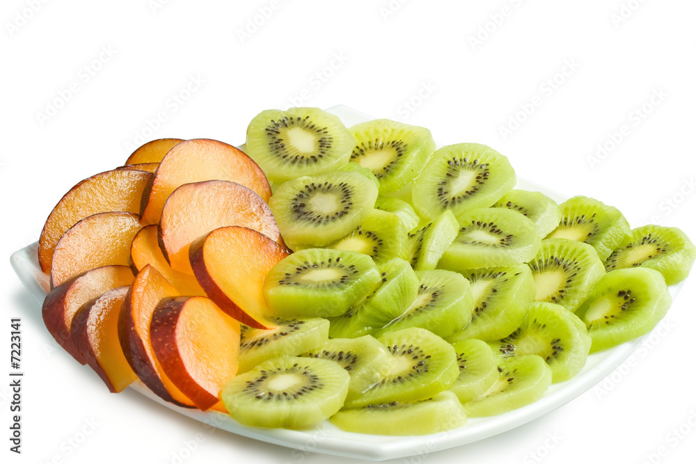 Kiwi and plum on a plate Kiwi and plum on a plate