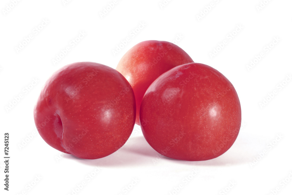 Red plums isolated on white background Red plums isolated on white background