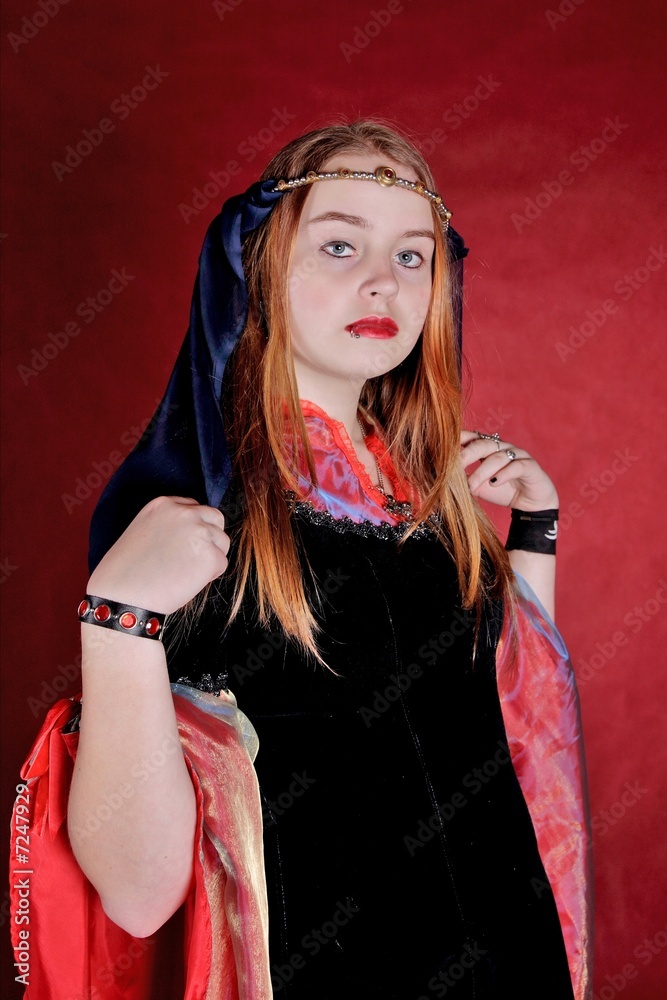 Naklejka premium Portrait of the girl in an ancient dress