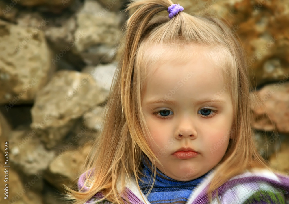 little girl walks in the spring on a young grass little girl walks in the spring on a young grass