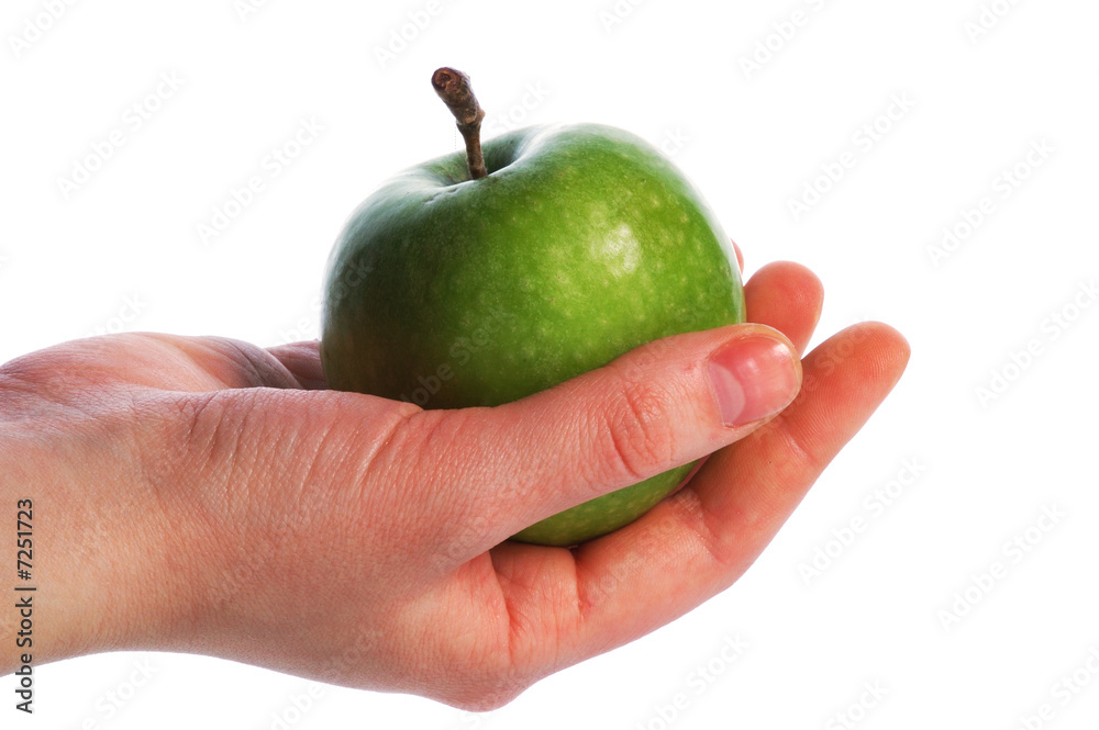 The thrown green tasty-looking apple from hand The thrown green tasty-looking apple from hand