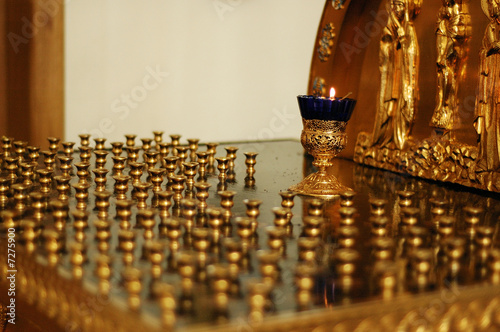 Candle stand in Orhodox Christian Temple photo