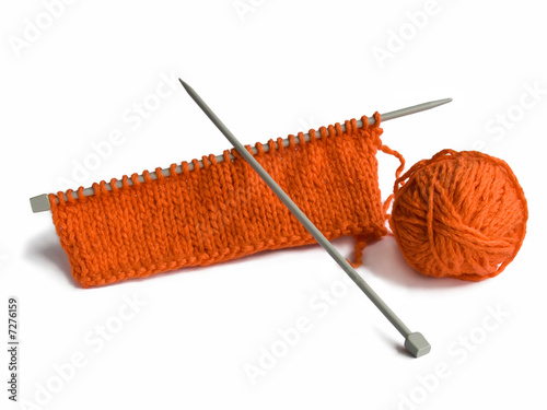 Thread and a spoke for knitting on a white background
