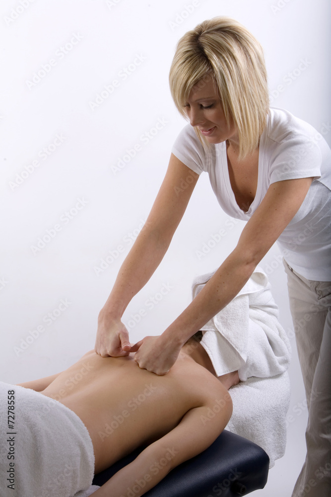 Massage therapist giving a massage Massage therapist giving a massage