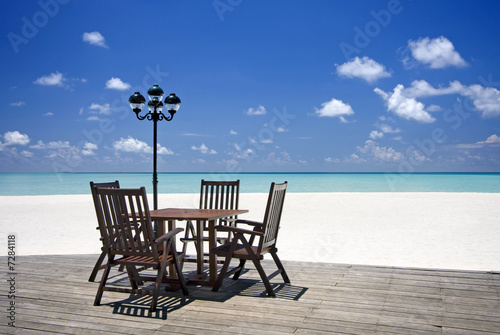 Table and chairs on beach veranda  Maldives