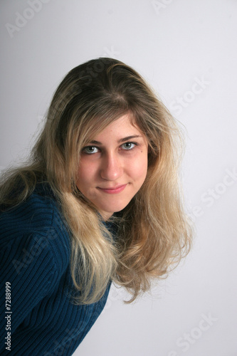 Smiling blond woman with eye contact