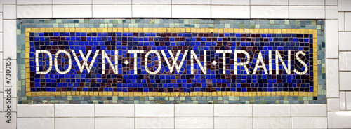Downtown trains sign in New York subway station photo