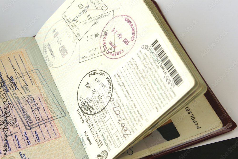 Obraz premium Passport with South Africa and Zimbabwe visas
