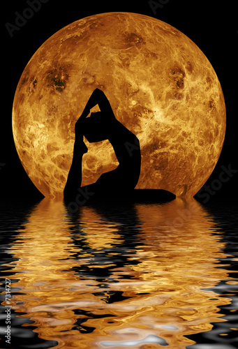 woman doing yoga on water background