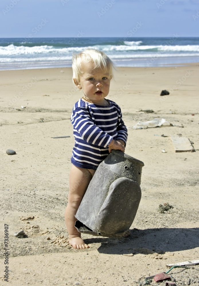 Cute little baby boy playing on the beach Cute little baby boy playing on the beach