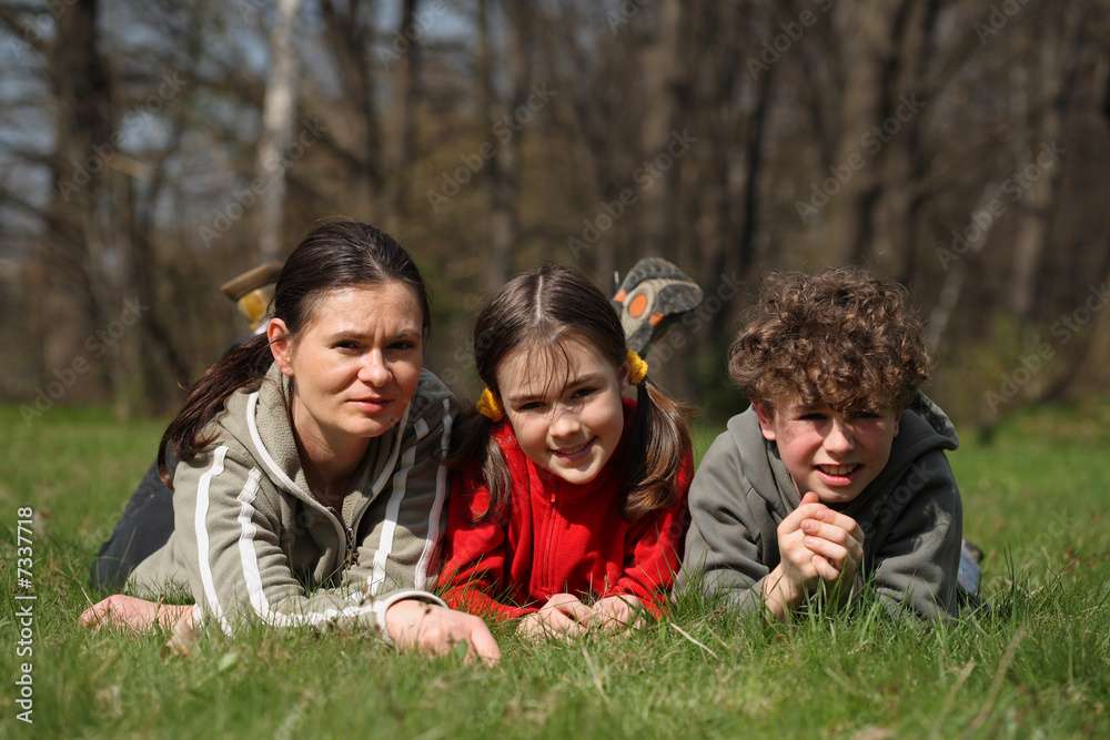 Fototapeta premium Mum with kids in park