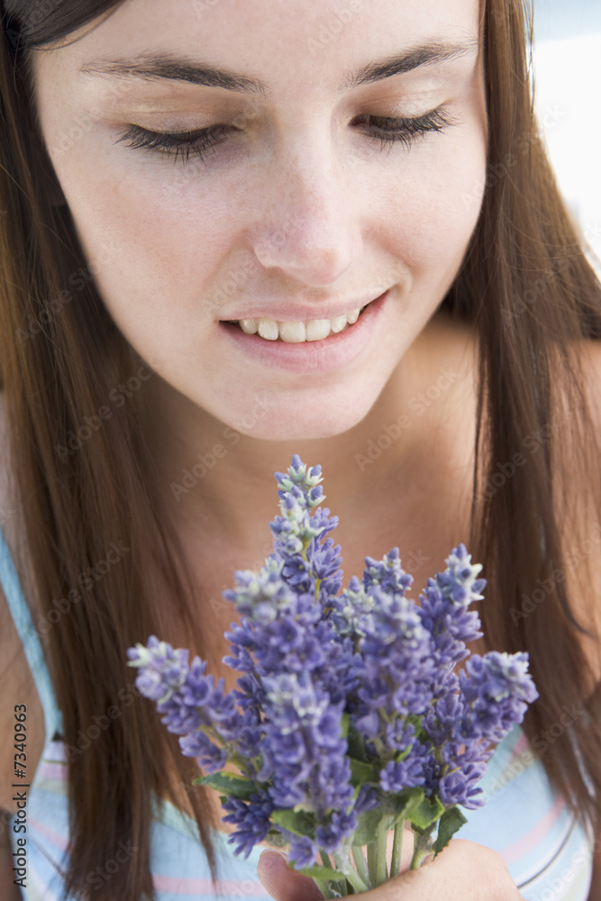 Woman looking at wild flowers Woman looking at wild flowers