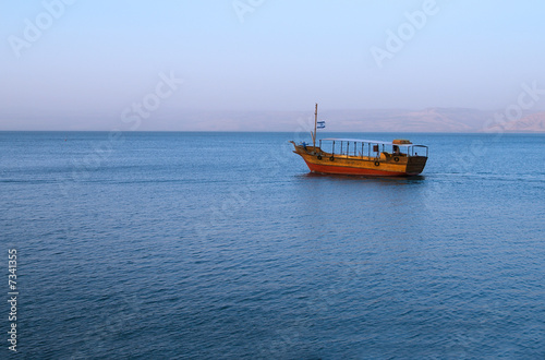Stampa su tela Boat on The sea of Galilee