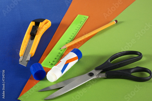 Group of office accessories on a color cardboard