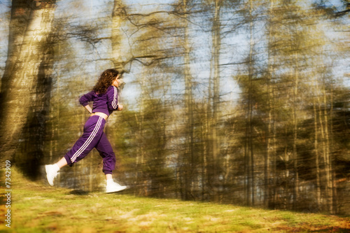 Girl running on the forest  in the summer