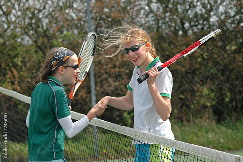 shaking hands after a game of tennis