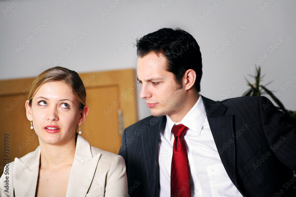 young businesswoman is stressed by her colleague young businesswoman is stressed by her colleague