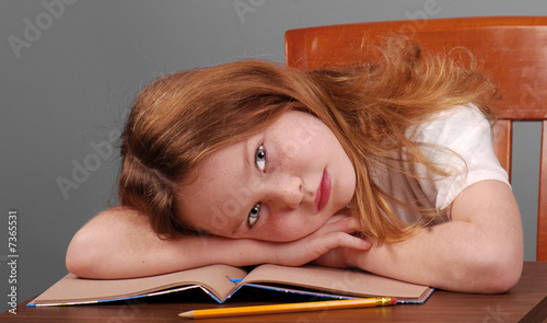 Girl Laying Down Head on Desk