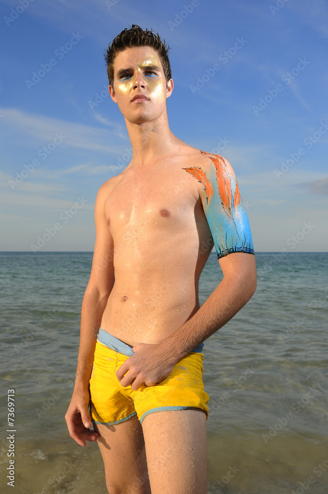 Portrait of young male model enjoying the beach Portrait of young male model enjoying the beach
