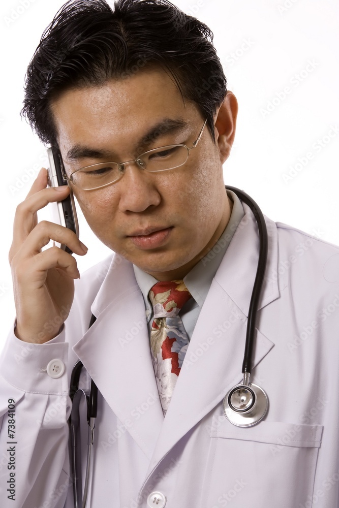 Asian Doctor With Mobile Phone Asian Doctor With Mobile Phone