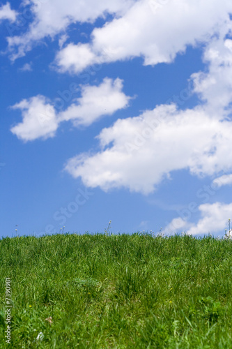 Hill green grass blue sky 2