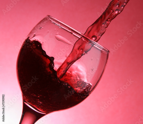 Closeup of pouring wine photo