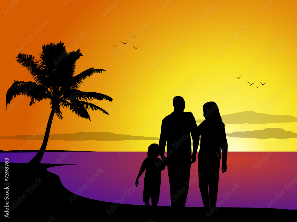 Family on a tropical beach at sunset
