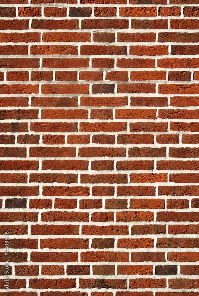 Fototapeta premium Red brick wall close up background.