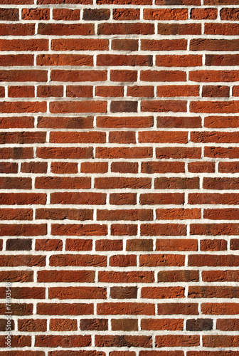 Red brick wall close up background.