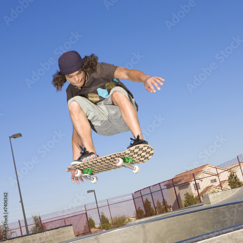 Skateboard tricks at a skateboard park