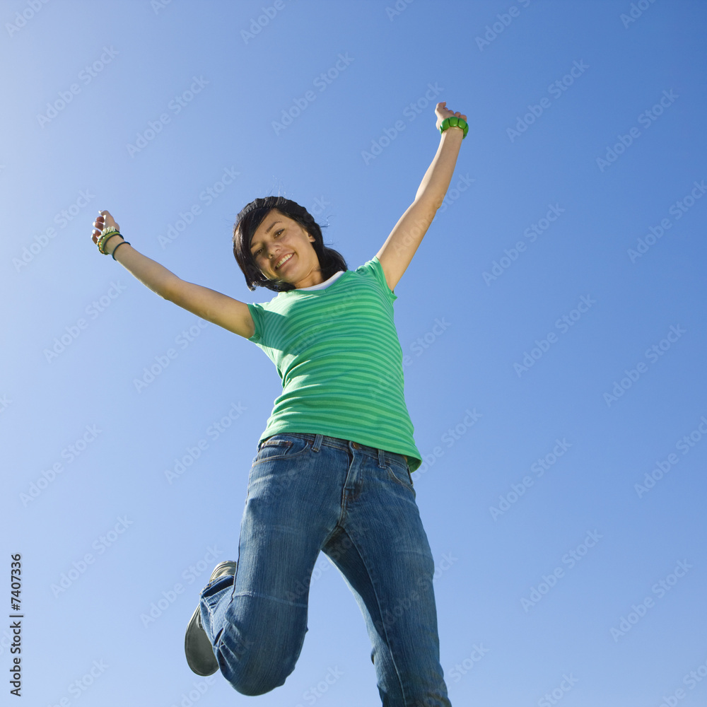 Happy teen jumps in air. Happy teen jumps in air.