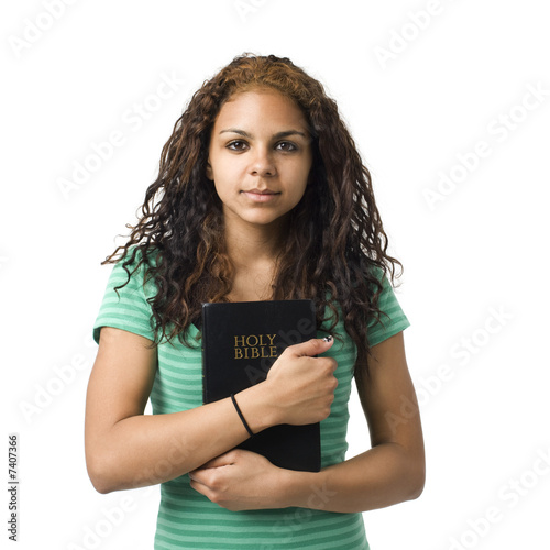 Girl holds bible