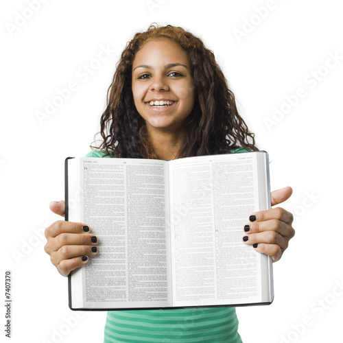 Girl holds bible