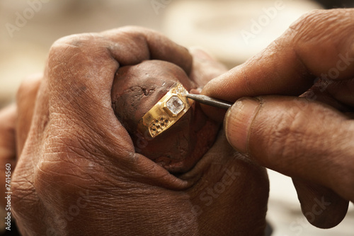 Goldsmith working on gold ring