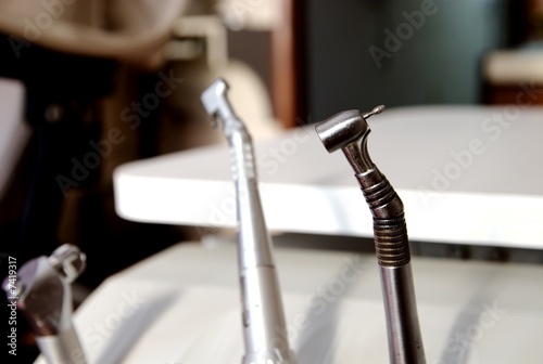 A dentists drill on a table in office room.