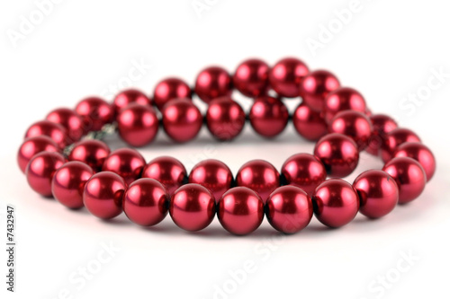 Red beads isolated on a white background.