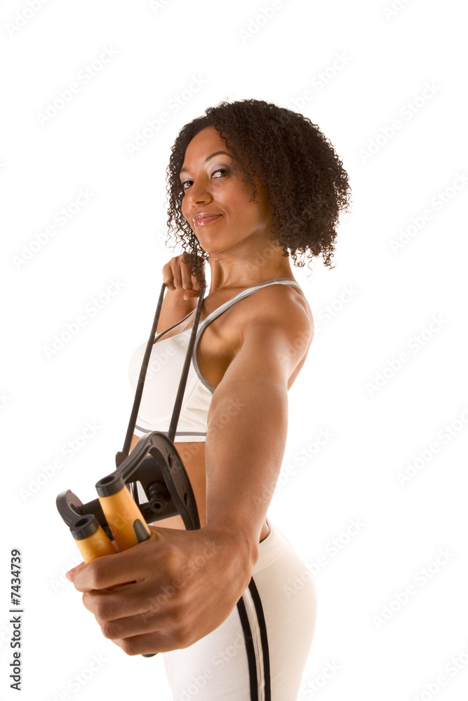 Dark skinned female exercising with Resistance Band (selective f Dark skinned female exercising with Resistance Band (selective f