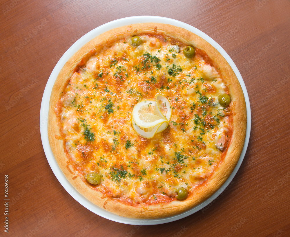 Tasty Italian pizza with lemon Tasty Italian pizza with lemon