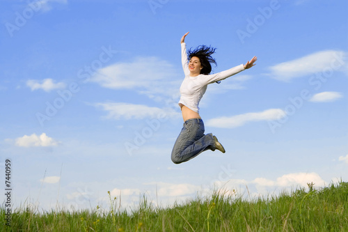 happy young woman is jumping