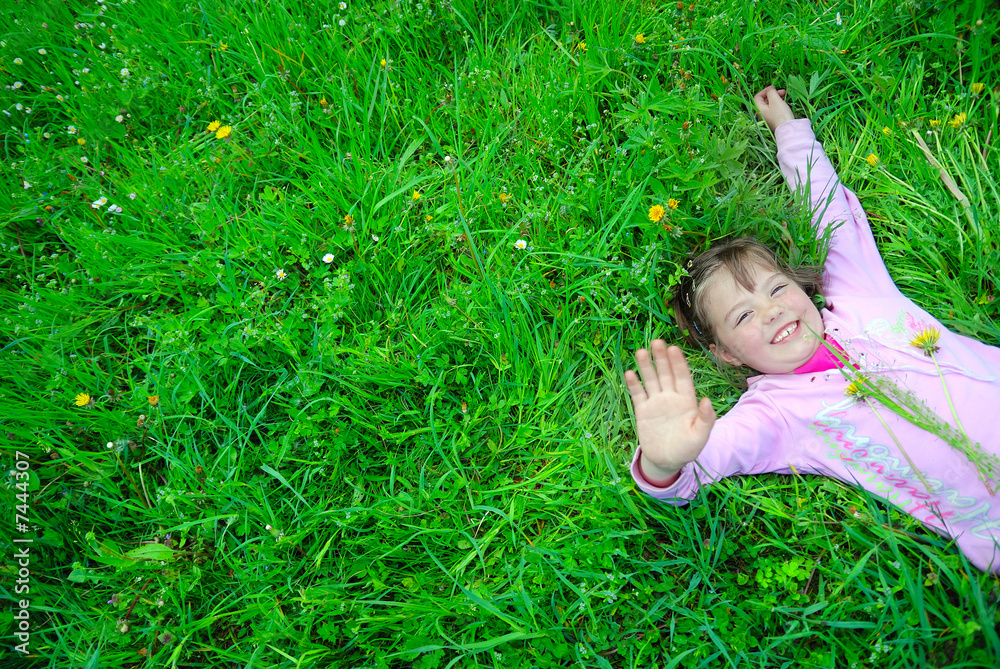 cute girl relaxing in grass cute girl relaxing in grass