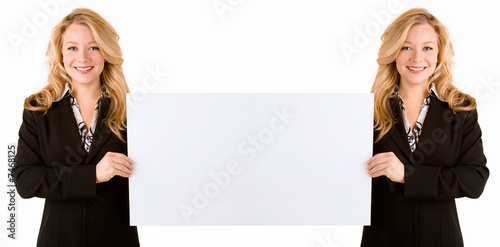 Obraz na plátne Mirrored Effect of Woman Holding a Large Blank Card