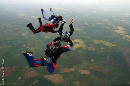Four Skydiver building a formation