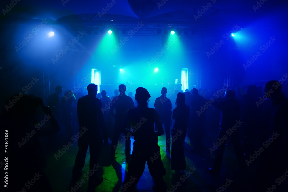 Dancing people in an underground club