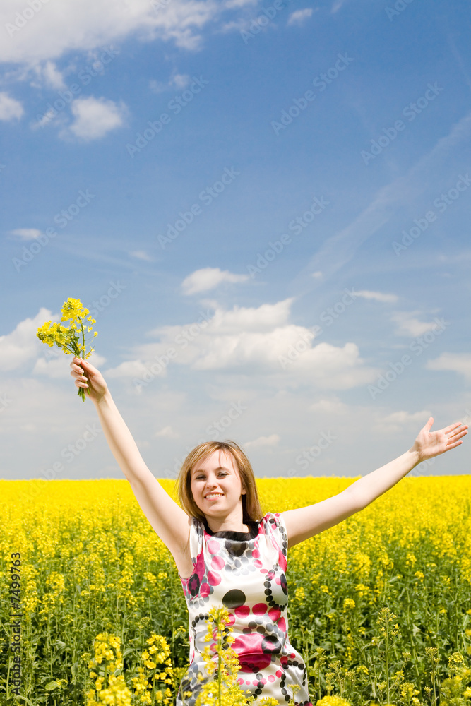 Naklejka premium Happy girl on the rape field.