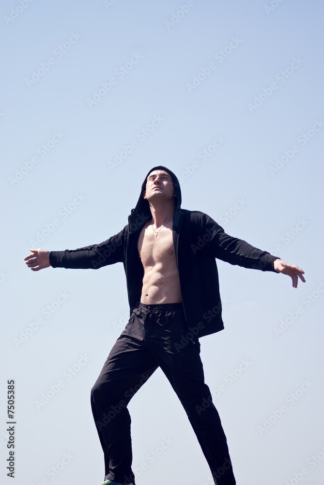 Sportsman witn naked chest in the hood Sportsman witn naked chest in the hood