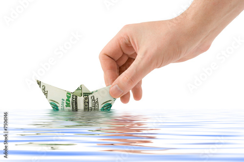 Hand launching money ship
