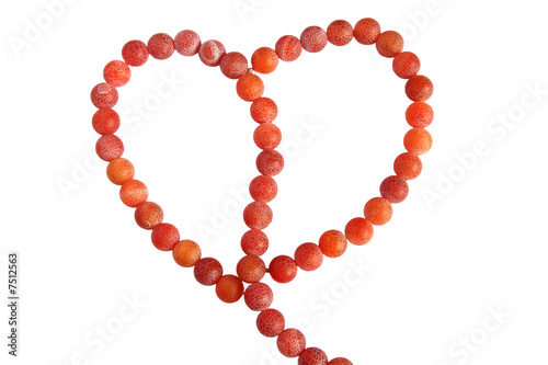 Heart shape made of aate beads isolated on white photo