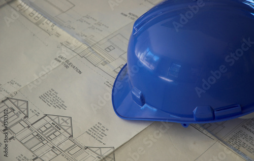 Hard hat and building plans