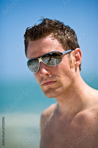 caucasian hunk at the beach with shades © eyedear